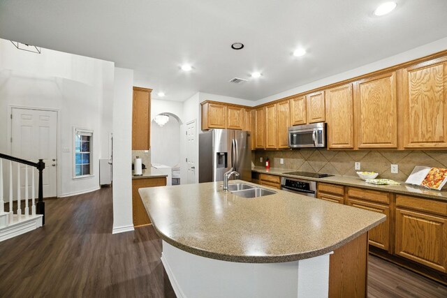 3801 Poppy Hills Cv, Round Rock, TX 78664 - kitchen with stainless steel appliances, dark wood finished floors, backsplash, a kitchen island with sink, and recessed lighting