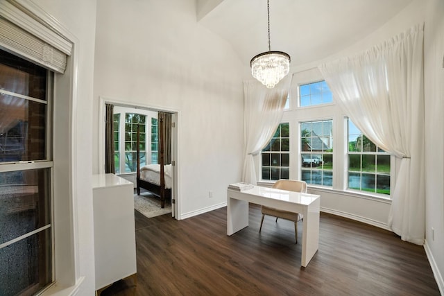 3801 Poppy Hills Cv, Round Rock, TX 78664 - unfurnished dining area with dark wood-style flooring, a chandelier, a desk, and high vaulted ceiling