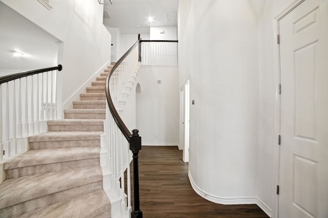 3801 Poppy Hills Cv, Round Rock, TX 78664 - stairway featuring wood finished floors and a high ceiling