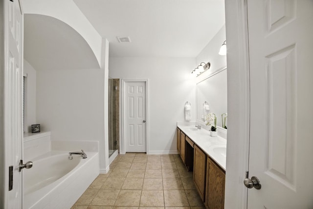 3801 Poppy Hills Cv, Round Rock, TX 78664 - bathroom with double vanity, a garden tub, and a stall shower