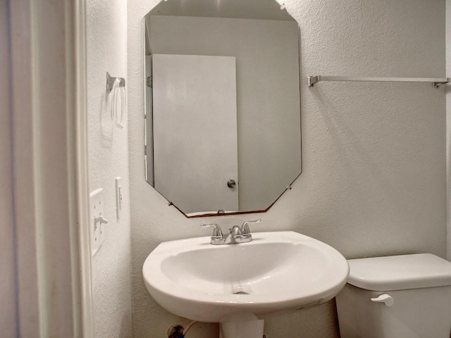 117 High Point Blvd, Cedar Creek, TX 78612 - bathroom with a sink and a textured wall