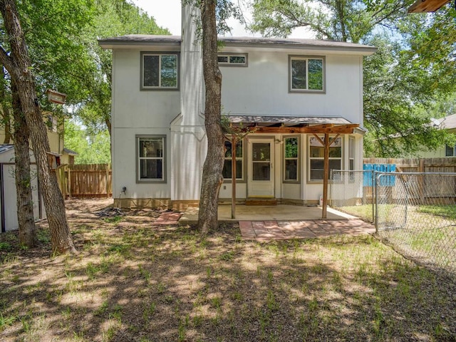 117 High Point Blvd, Cedar Creek, TX 78612 - back of house with a patio, a fenced backyard, and an outdoor structure