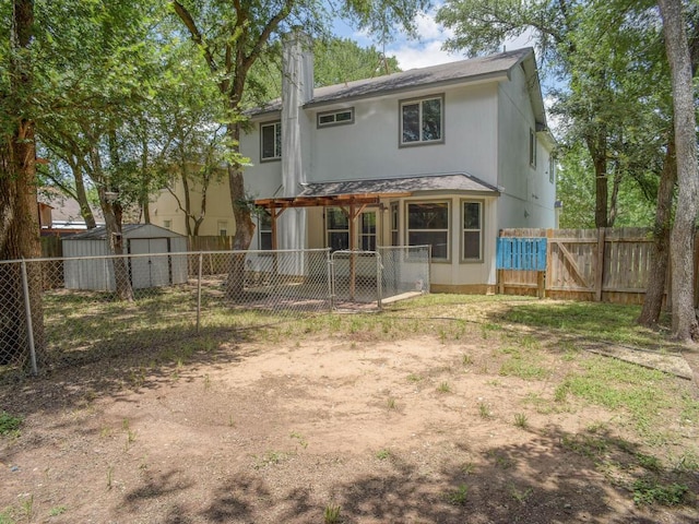 117 High Point Blvd, Cedar Creek, TX 78612 - back of house featuring a fenced backyard, a gate, and a storage unit