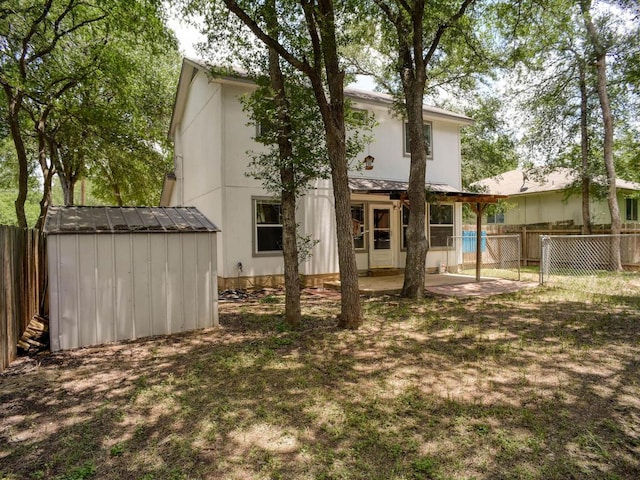 117 High Point Blvd, Cedar Creek, TX 78612 - back of property featuring a shed, a fenced backyard, and a patio area