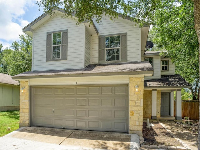 117 High Point Blvd, Cedar Creek, TX 78612 - traditional-style house featuring an attached garage, stone siding, a shingled roof, and driveway