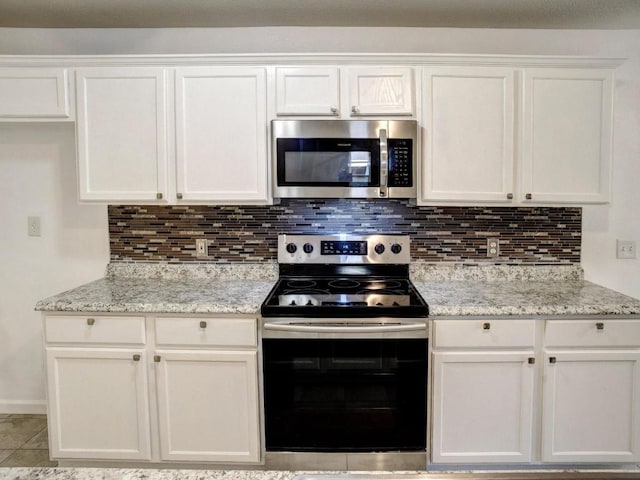 117 High Point Blvd, Cedar Creek, TX 78612 - kitchen with stainless steel appliances and white cabinetry