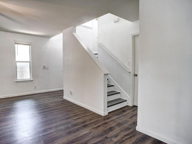 117 High Point Blvd, Cedar Creek, TX 78612 - unfurnished living room with stairs and dark wood-style flooring