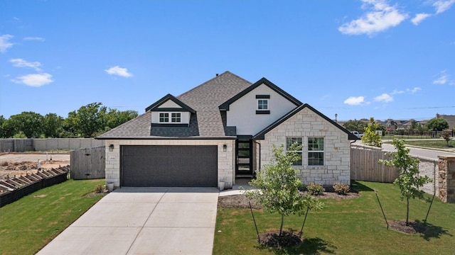 20240 Smedley Dr, Pflugerville, TX 78660 - view of front of house with stone siding, driveway, roof with shingles, and an attached garage