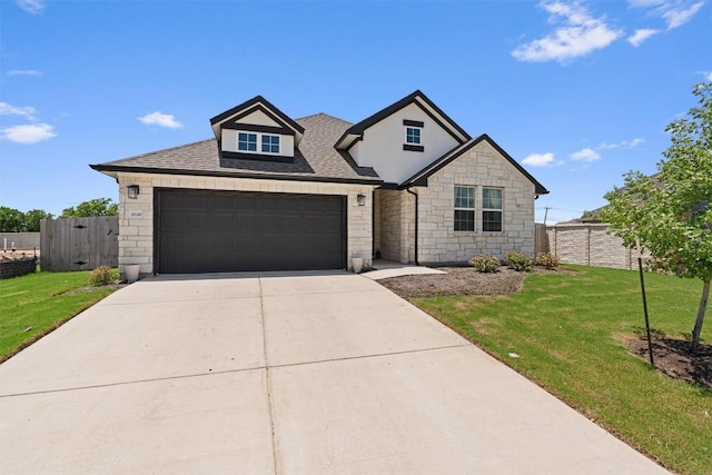 20240 Smedley Dr, Pflugerville, TX 78660 - view of front of property with stone siding, an attached garage, concrete driveway, and a shingled roof