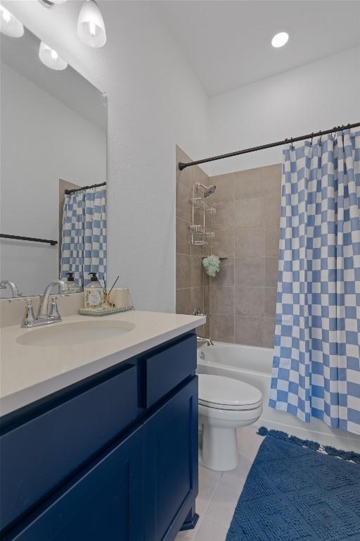 20240 Smedley Dr, Pflugerville, TX 78660 - bathroom with vanity, shower / bath combo with shower curtain, and tile patterned floors