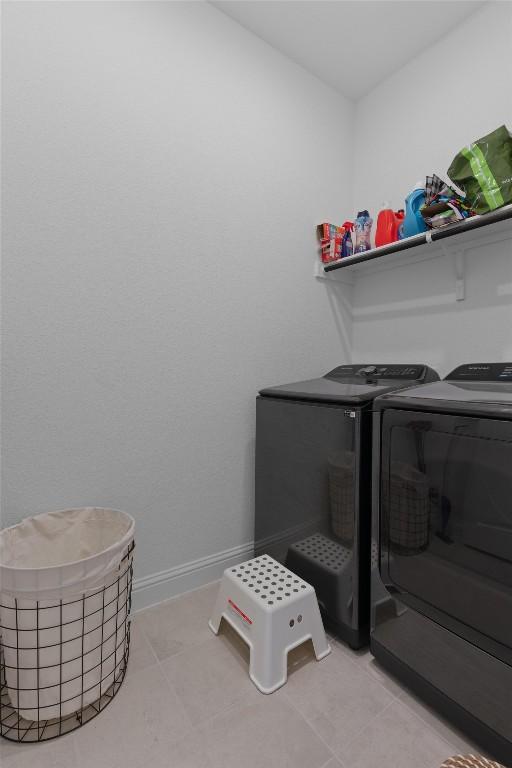 20240 Smedley Dr, Pflugerville, TX 78660 - washroom featuring independent washer and dryer and light tile patterned flooring