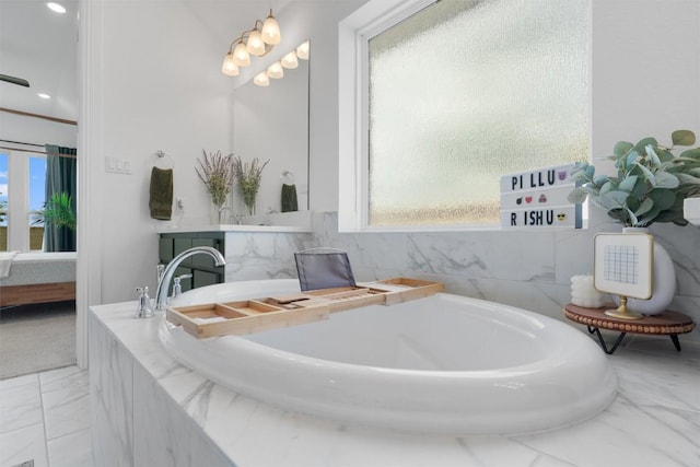20240 Smedley Dr, Pflugerville, TX 78660 - full bathroom with connected bathroom, a bath, vanity, and marble finish floors