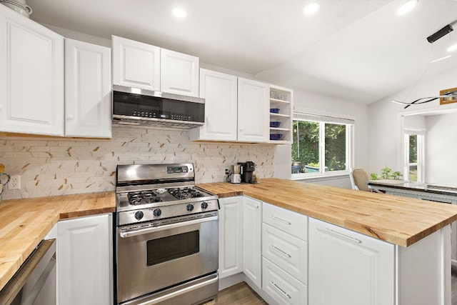 15002 Wells Port Dr, Austin, TX 78728 - kitchen featuring wooden counters, appliances with stainless steel finishes, vaulted ceiling, a peninsula, and recessed lighting