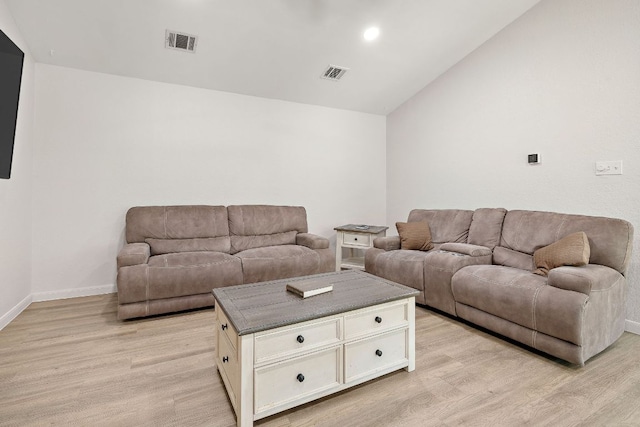 15002 Wells Port Dr, Austin, TX 78728 - living room with light wood finished floors, vaulted ceiling, and recessed lighting