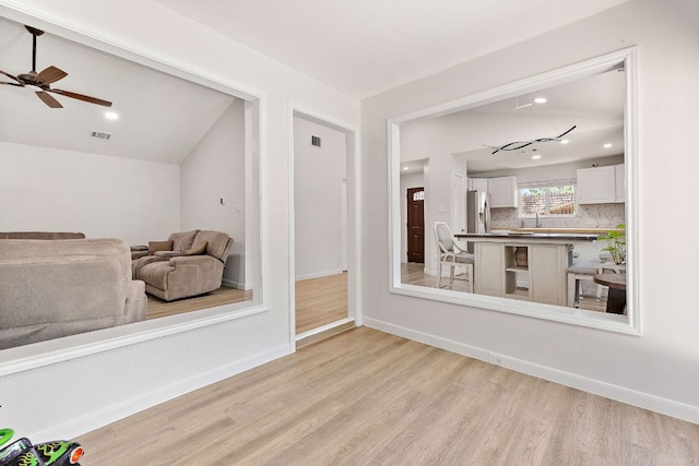15002 Wells Port Dr, Austin, TX 78728 - living area with ceiling fan, light wood-style floors, recessed lighting, and lofted ceiling