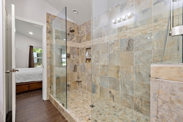 15002 Wells Port Dr, Austin, TX 78728 - bathroom with ensuite bathroom, lofted ceiling, a tile shower, wood finished floors, and recessed lighting