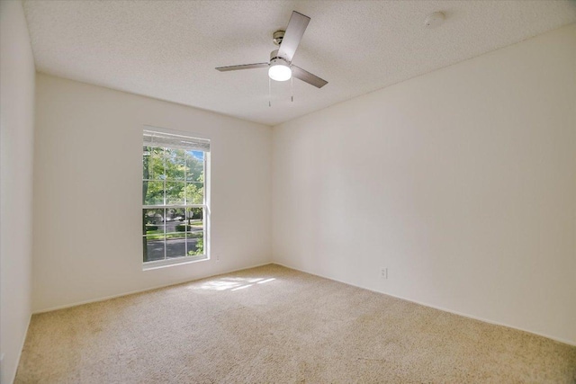 3413 Latimer Dr, Austin, TX 78732 - carpeted spare room with a ceiling fan, a textured ceiling, and a smoke detector