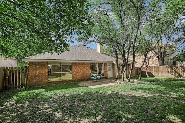 3413 Latimer Dr, Austin, TX 78732 - rear view of property featuring a patio, a fenced backyard, brick siding, and a chimney