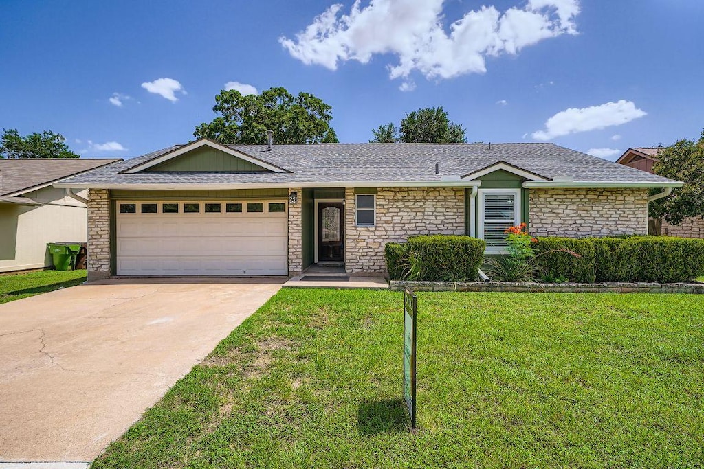 601 Yucca Dr, Round Rock, TX 78681 - ranch-style house featuring stone siding, driveway, an attached garage, a front lawn, and a shingled roof