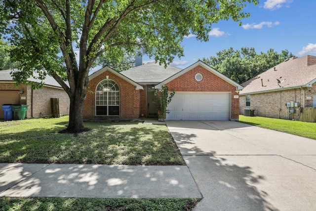 17003 Jigsaw Pathway, Round Rock, TX 78664 - view of front facade with driveway, an attached garage, brick siding, and a front yard