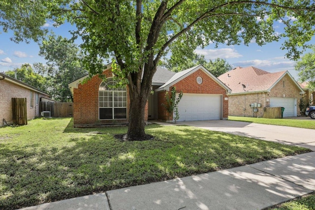 17003 Jigsaw Pathway, Round Rock, TX 78664 - view of front of home with driveway, a garage, and brick siding