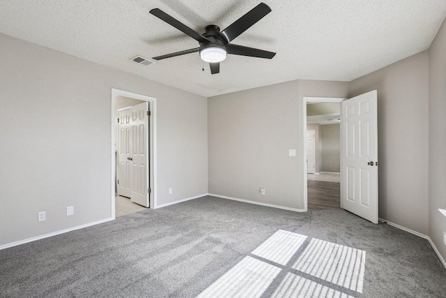 17003 Jigsaw Pathway, Round Rock, TX 78664 - unfurnished bedroom with carpet floors, a textured ceiling, a ceiling fan, and ensuite bath