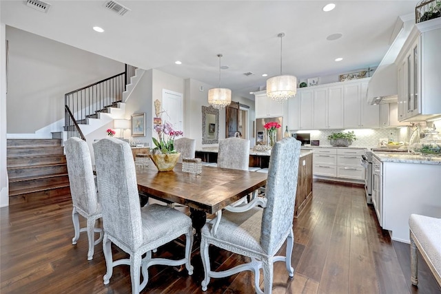 3973 River Place Blvd, Austin, TX 78730 - dining area with stairway, a chandelier, dark wood-style flooring, and recessed lighting