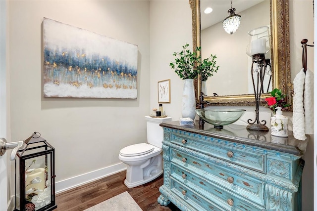3973 River Place Blvd, Austin, TX 78730 - half bathroom featuring vanity, wood finished floors, and recessed lighting