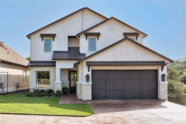 3973 River Place Blvd, Austin, TX 78730 - view of front facade featuring a standing seam roof, driveway, a garage, stucco siding, and stone siding