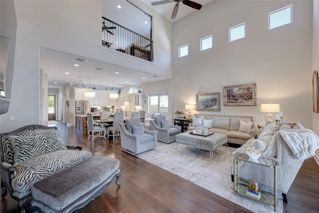 3973 River Place Blvd, Austin, TX 78730 - living room with ceiling fan, a high ceiling, and dark wood-type flooring
