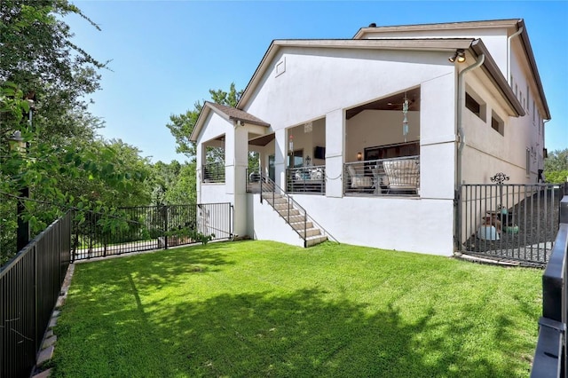 3973 River Place Blvd, Austin, TX 78730 - rear view of house with a fenced backyard, stucco siding, and stairs