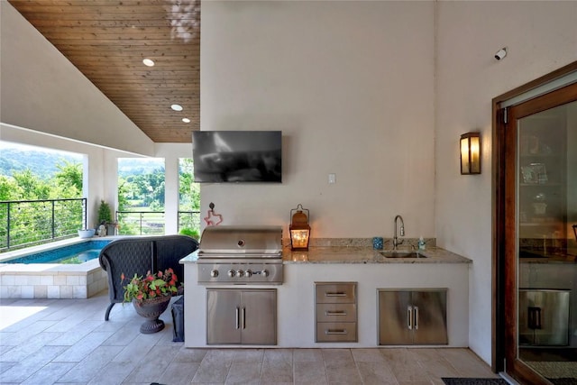 3973 River Place Blvd, Austin, TX 78730 - view of patio / terrace featuring an outdoor kitchen and a jacuzzi