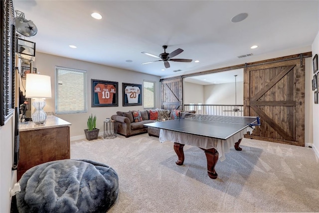 3973 River Place Blvd, Austin, TX 78730 - game room featuring a barn door, carpet floors, ceiling fan, plenty of natural light, and recessed lighting