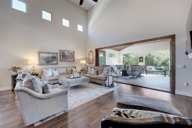 3973 River Place Blvd, Austin, TX 78730 - living room featuring a ceiling fan, a towering ceiling, and dark wood finished floors