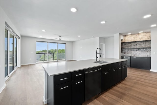 4510 Terry-O Ln Unit 230, Austin, TX 78745 - kitchen with dishwasher, open floor plan, a kitchen island with sink, light countertops, and recessed lighting