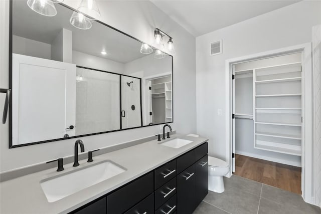 4510 Terry-O Ln Unit 230, Austin, TX 78745 - full bath featuring a walk in closet, tile patterned flooring, double vanity, and a shower stall