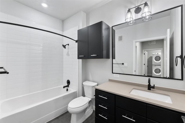 4510 Terry-O Ln Unit 230, Austin, TX 78745 - full bathroom featuring stacked washing machine and dryer, vanity, and shower / bathtub combination