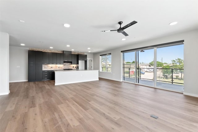 4510 Terry-O Ln Unit 230, Austin, TX 78745 - unfurnished living room with a ceiling fan, recessed lighting, and light wood-style flooring