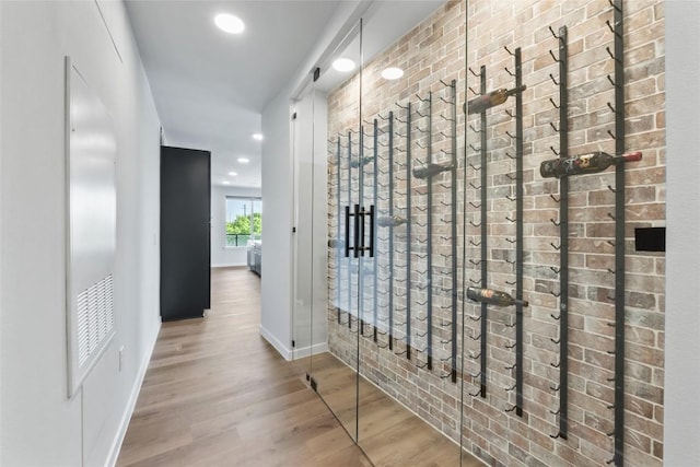 4510 Terry-O Ln Unit 230, Austin, TX 78745 - hall with wood finished floors, recessed lighting, and brick wall