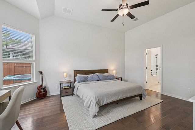 958 Pink Granite Blvd, Dripping Springs, TX 78620 - bedroom featuring dark wood finished floors, vaulted ceiling, ceiling fan, and ensuite bath