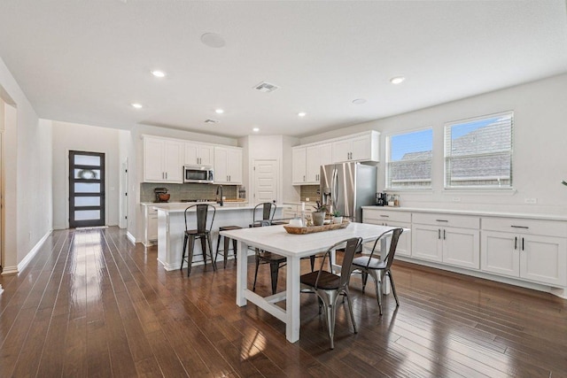 958 Pink Granite Blvd, Dripping Springs, TX 78620 - dining area with dark wood-style floors and recessed lighting