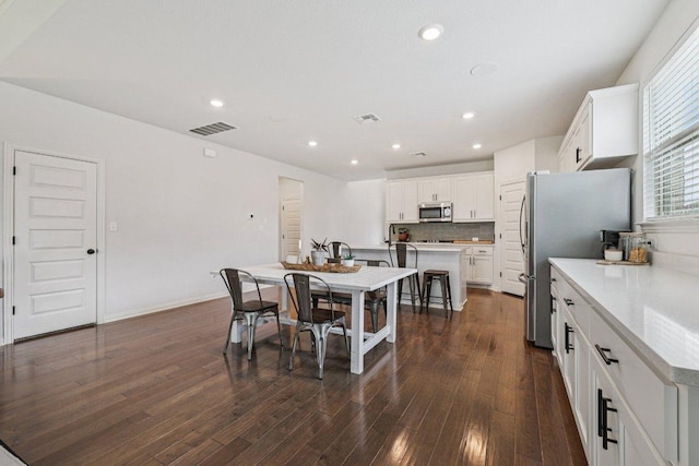 958 Pink Granite Blvd, Dripping Springs, TX 78620 - dining room with dark wood finished floors and recessed lighting