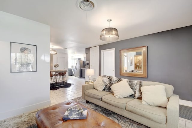 313 Rowland Dr, Austin, TX 78745 - living room with light tile patterned flooring and baseboards