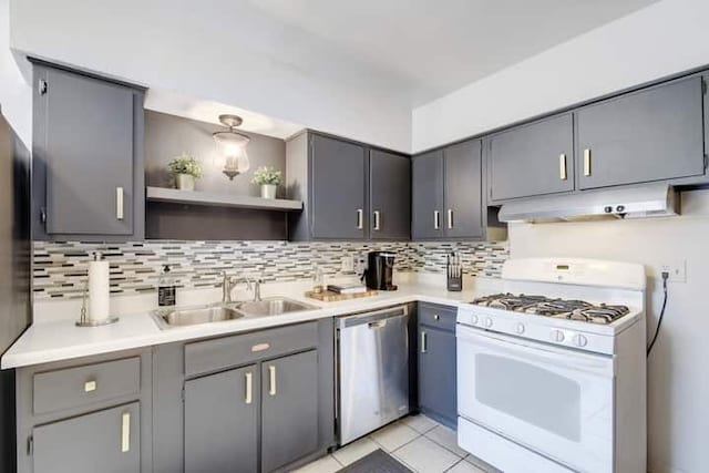 313 Rowland Dr, Austin, TX 78745 - kitchen featuring white gas stove, under cabinet range hood, dishwasher, and gray cabinetry