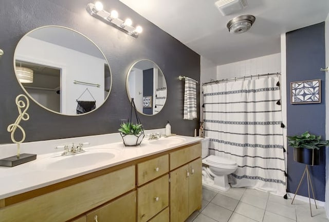 313 Rowland Dr, Austin, TX 78745 - bathroom with tile patterned flooring, double vanity, and a shower with curtain