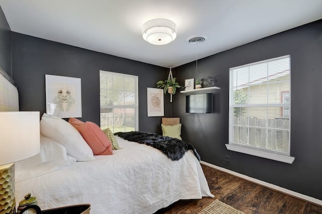 313 Rowland Dr, Austin, TX 78745 - bedroom with dark wood finished floors and baseboards