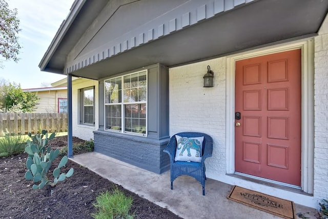313 Rowland Dr, Austin, TX 78745 - property entrance featuring brick siding and a porch