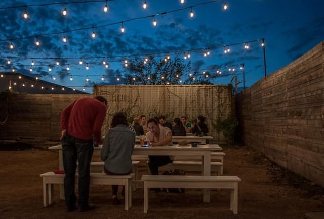 313 Rowland Dr, Austin, TX 78745 - patio at twilight with a fenced backyard