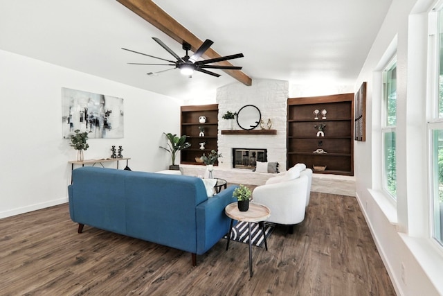 2207 Emerald Isle Dr, Leander, TX 78641 - living area featuring ceiling fan, dark wood-style floors, and a fireplace