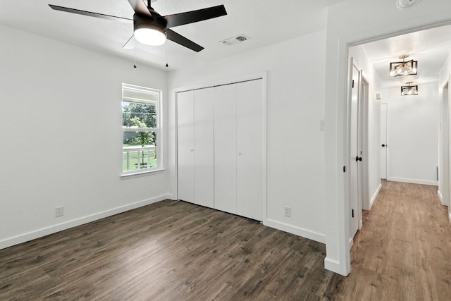 2207 Emerald Isle Dr, Leander, TX 78641 - unfurnished bedroom with dark wood-style floors, a closet, and ceiling fan